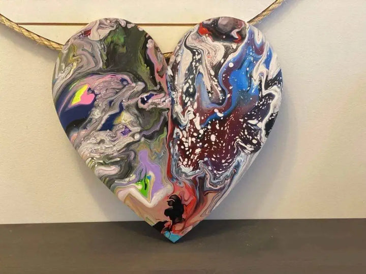 Handcrafted artisan wooden hearts wall art with vibrant, unique acrylic paint design.
