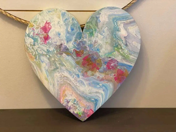 Handcrafted artisan wooden hearts wall art with colorful acrylic paints.