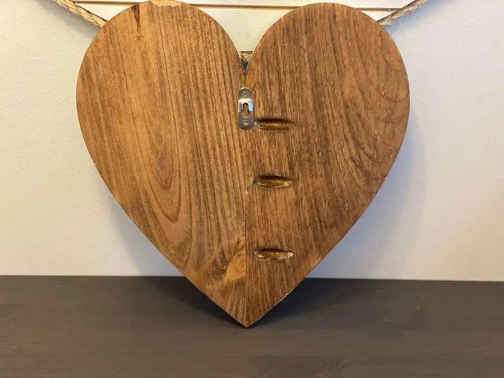 Handcrafted wooden hearts wall art decor with natural finish and wall hanger attachment.