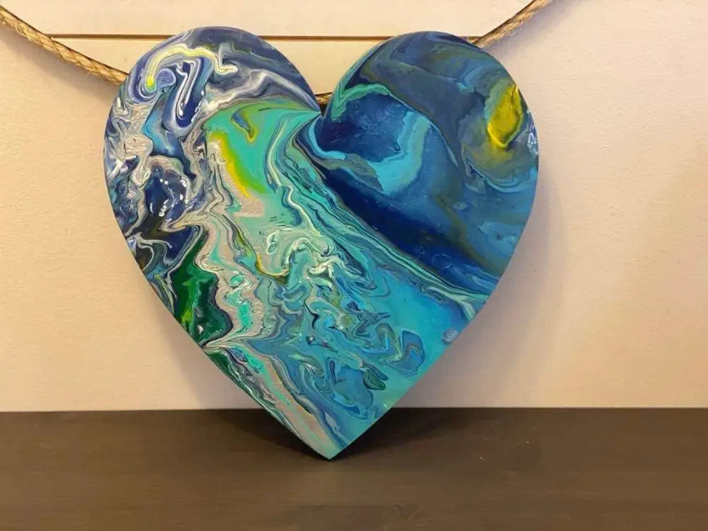 Handcrafted artisan wooden hearts wall art decor with blue and green acrylic paint design.