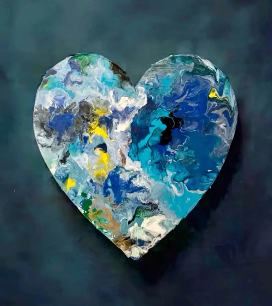 Handcrafted artisan wooden heart wall art with abstract blue, yellow, and white acrylic paint design on solid pine wood.