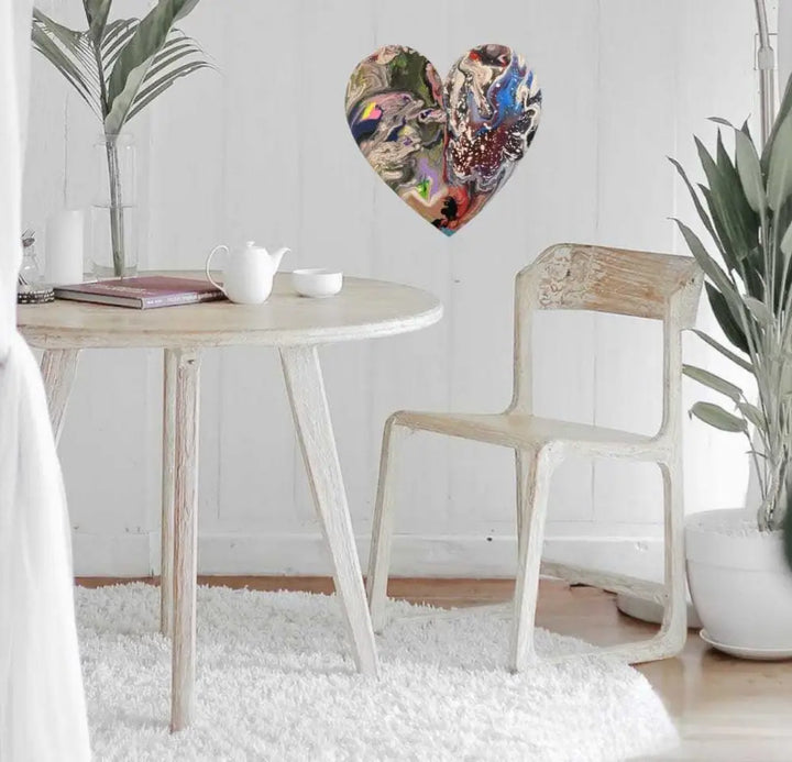 Handcrafted wooden hearts wall art in a modern living room setting.