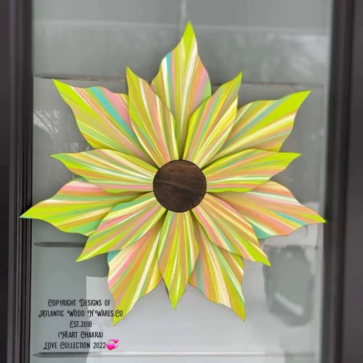 Handcrafted Love Flower Door Decoration in springtime colors, pine construction with exterior paint, measures 22x22 inches. Suitable for all seasons.