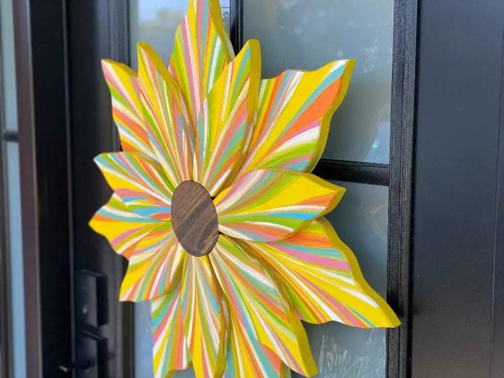 Handcrafted flower door decoration in vibrant colors for all seasons.