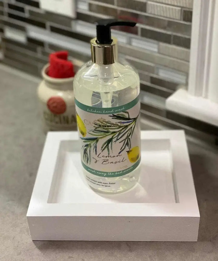 Handcrafted pine soap dish in white with liquid soap on a countertop.