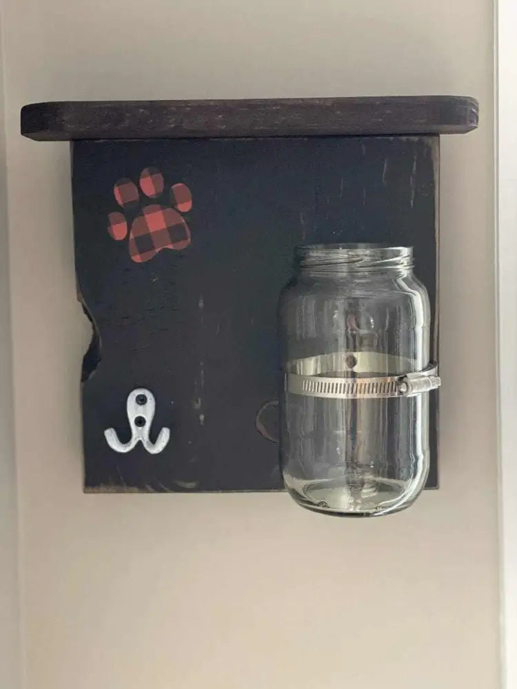 Handmade dog treat and leash holder with shelf, hook, and swivel jar for entryway.