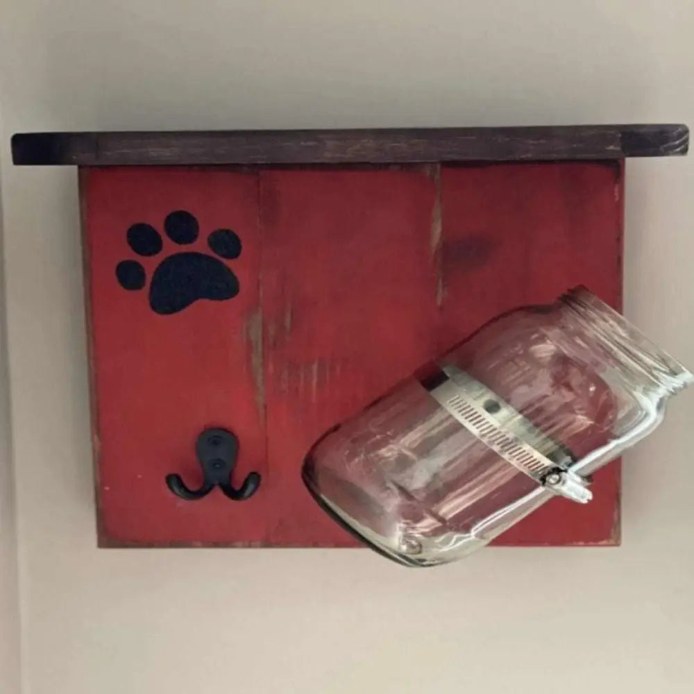 Handmade dog treat and leash holder with jar and hook, painted in red.