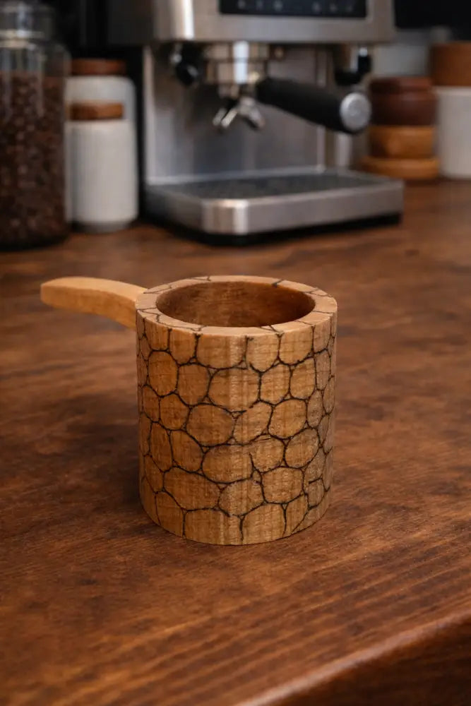 Rustic handmade wooden coffee scoop with honeycomb crackle finish and light-brown handle