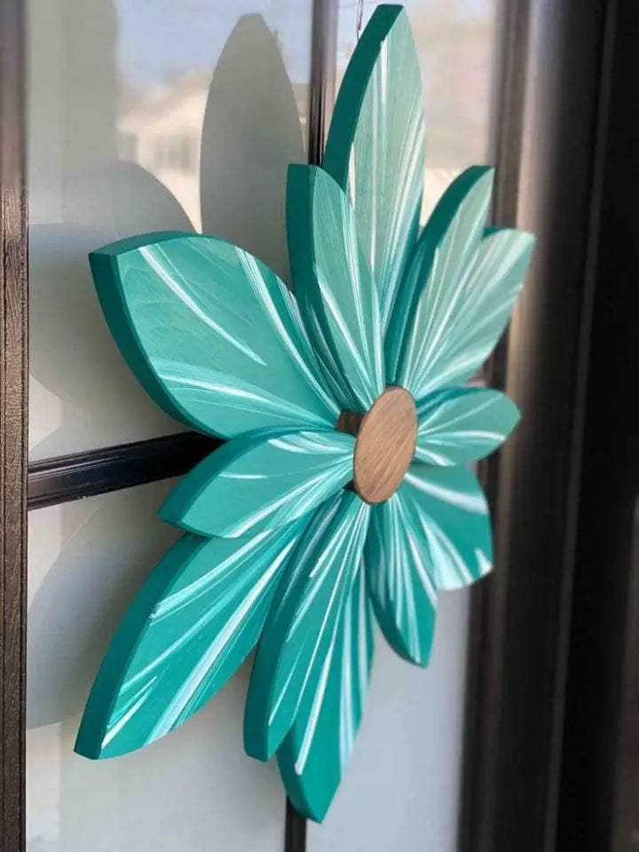 Handcrafted juniper green wooden flower door decoration with blue undertones, durable pine wood, weather-resistant finish.