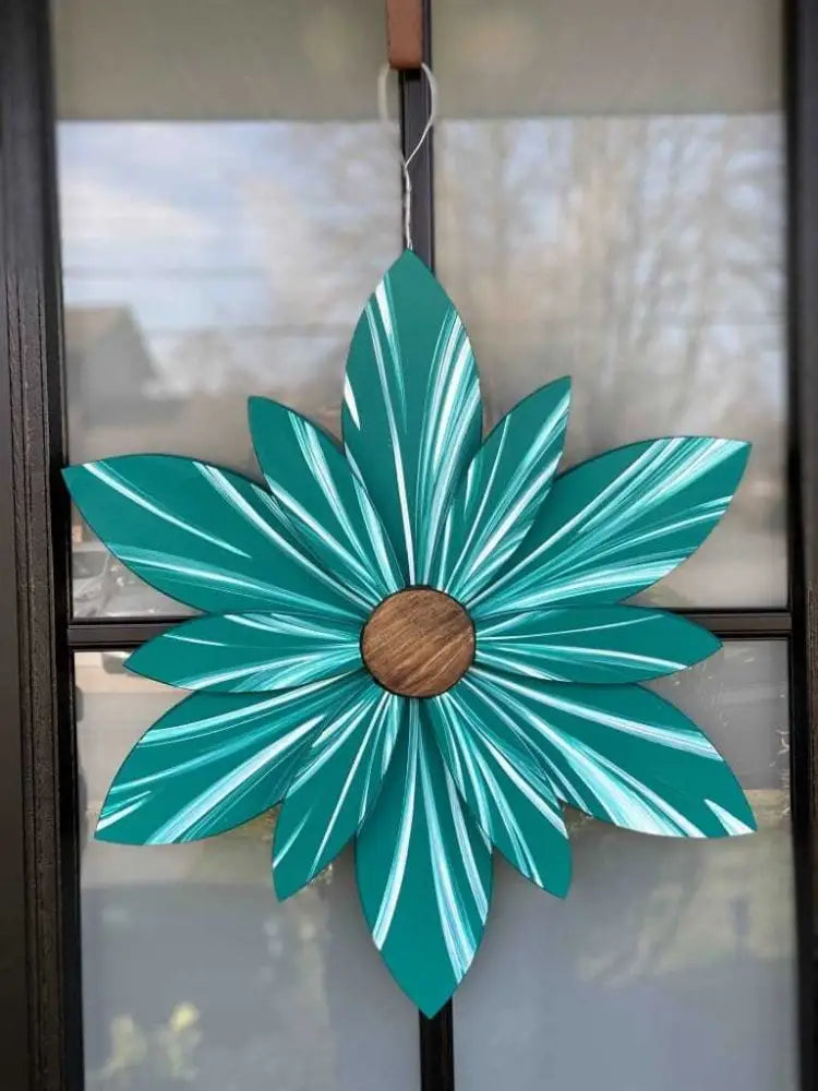 Handcrafted juniper green wooden flower door decoration with blue undertones, featuring a weather-resistant finish and wire hanger for easy installation.