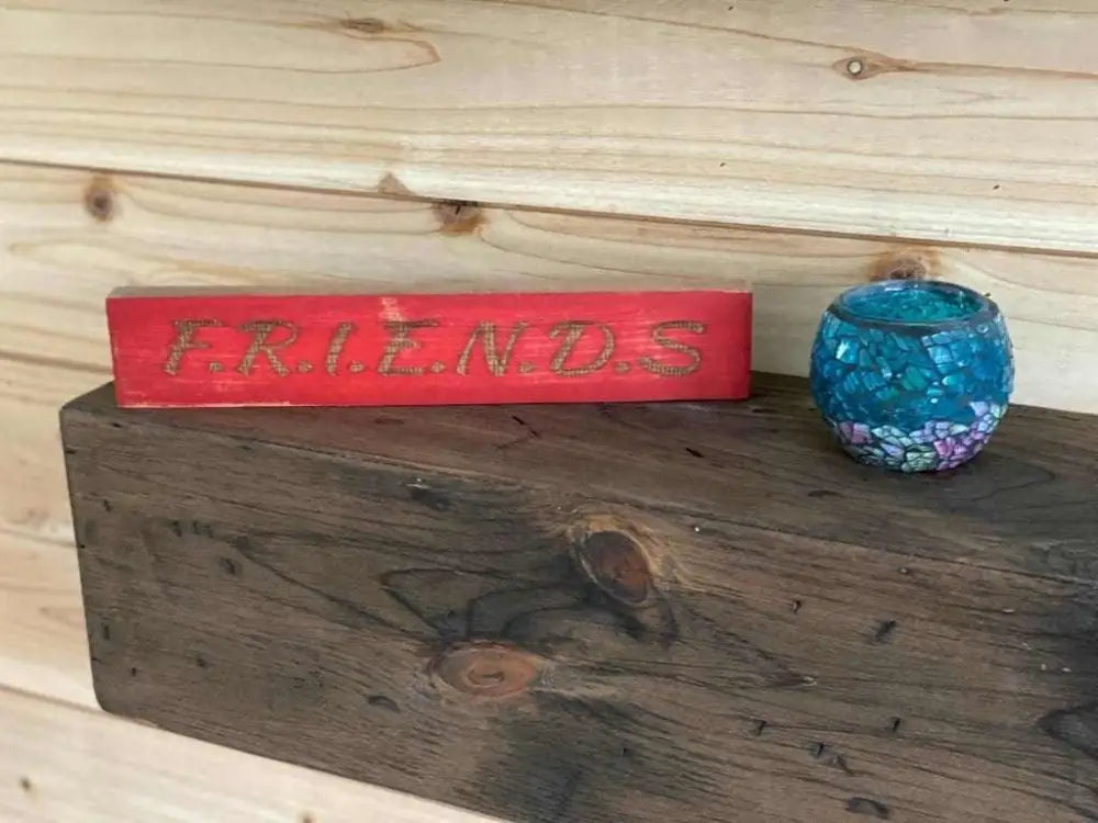 Laser engraved friendship sign on a wooden shelf, perfect gift for best friend.