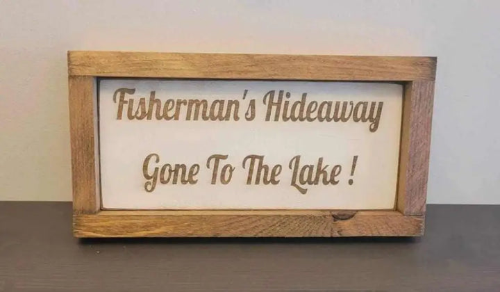 Laser engraved wood sign for outdoor lovers reading "Fisherman's Hideaway Gone To The Lake".