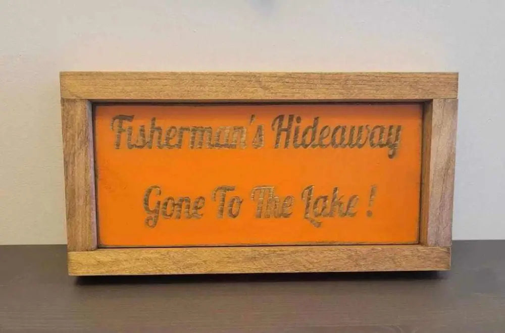 Laser engraved wood sign for outdoor enthusiasts with "Fisherman's Hideaway - Gone To The Lake" design.