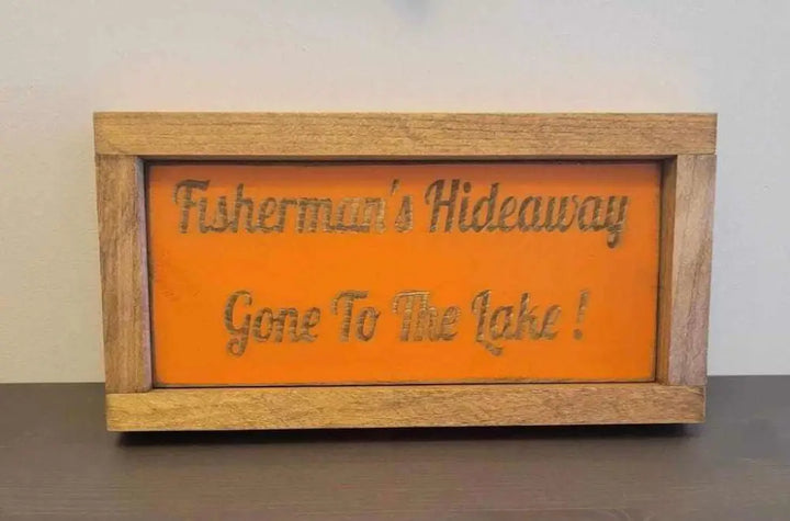 Laser engraved wood sign for outdoor enthusiasts with "Fisherman's Hideaway - Gone To The Lake" design.