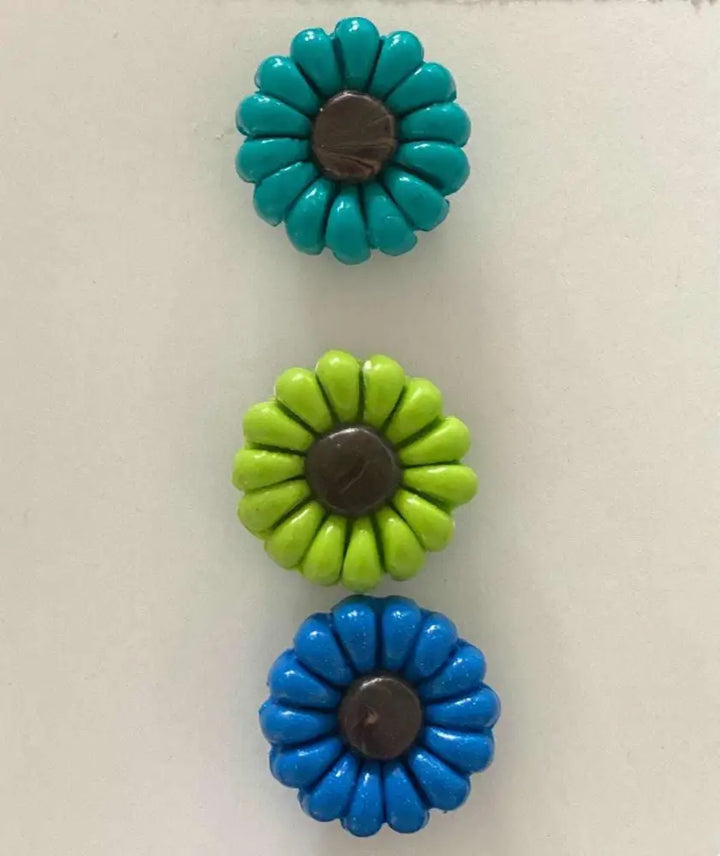Colorful polyclay daisy fridge magnets, set of three, supporting IWK Foundation.