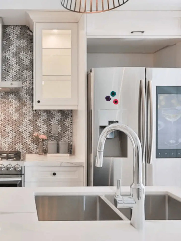 Polyclay Daisy Fridge Magnets on stainless steel refrigerator in modern kitchen.