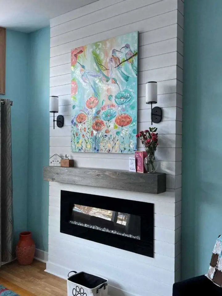 Handcrafted rustic wood fireplace mantel in modern living room setting.