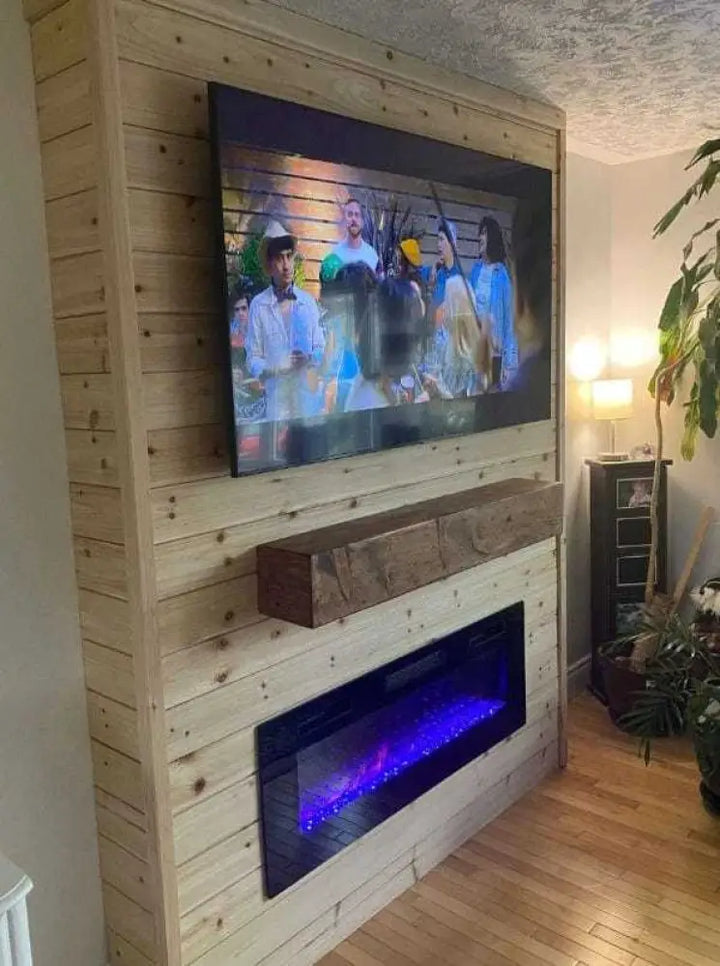 Rustic wood fireplace mantel, handcrafted in Canada, enhancing modern living room decor with TV and electric fireplace.