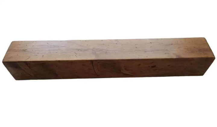 Rustic handcrafted wood fireplace mantel, durable Canadian craftsmanship.