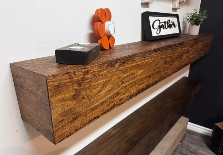Rustic dark brown wooden floating shelf with visible grain and natural imperfections from Handcrafted Canadian Mantels
