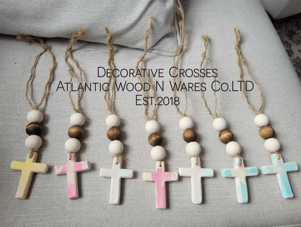 Rustic handmade wooden bead and cross garland for home decor.