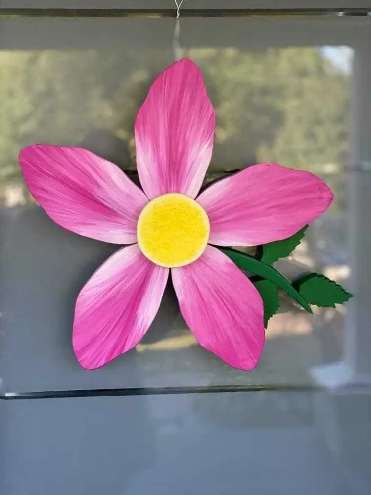 Wooden Alberta Wild Rose door decoration in vibrant pink with yellow center, 19x19 inches, handcrafted for indoor and outdoor use.