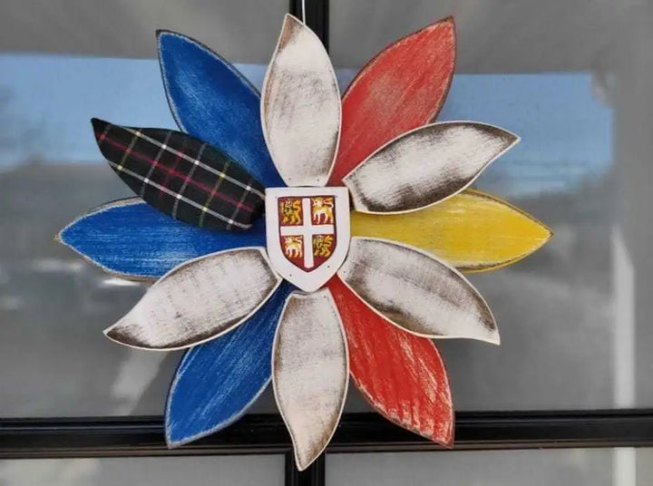 Handcrafted wooden flower art with provincial tartan petal decoration.
