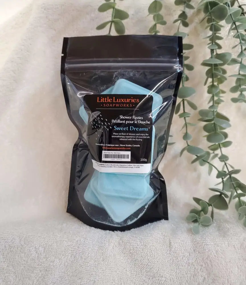 Sweet Dreams shower steamers with lavender and sweet orange essential oils in black resealable pouch by Little Luxuries Soapworks