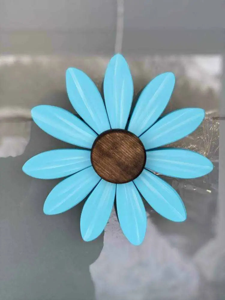 Handcrafted blue wooden flower art with brown center supporting Sofia Daisy Campaign for children with heart conditions in Canada