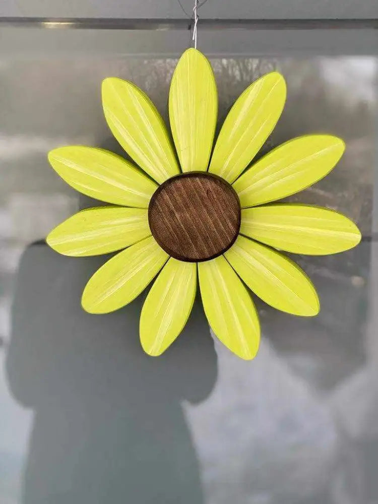 Handcrafted yellow wooden flower art with brown center supporting Sofia Daisy Campaign for children with heart conditions in Canada
