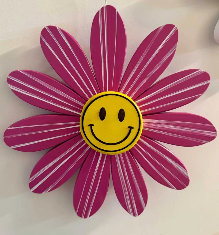Handcrafted pink wooden daisy flower art with smiley face center supporting Sofia Daisy Campaign for congenital heart condition awareness in Canada