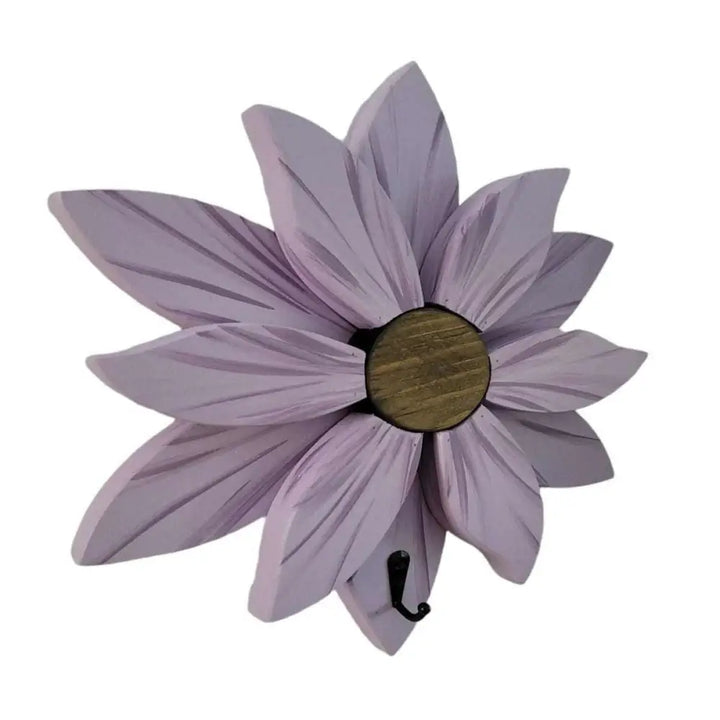 Handcrafted wooden flower wall decoration with lavender petals and a rustic center.