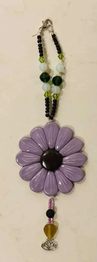 Purple Sofia Daisy car and window charm with black lava bead and assorted glass beads on elastic cord