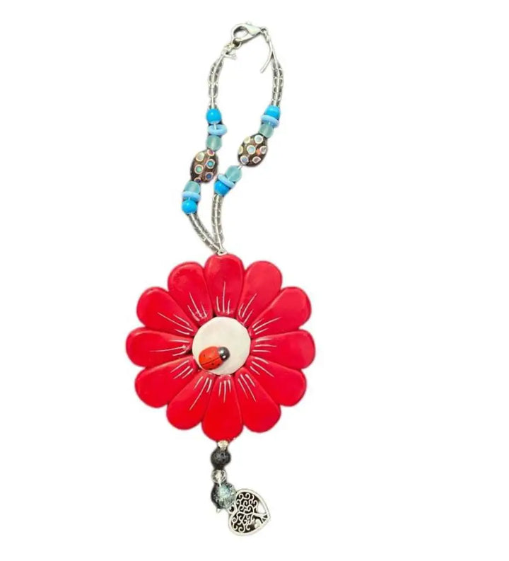 Sofia Daisy Charm with polymer clay petals and glass beads, supporting IWK Foundation.