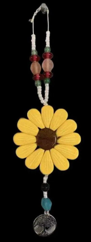 Hand-sculpted yellow daisy car window charm with beads and tree pendant supporting IWK Foundation