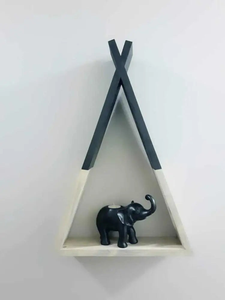 Handcrafted teepee-shaped wooden shelf with decorative elephant.