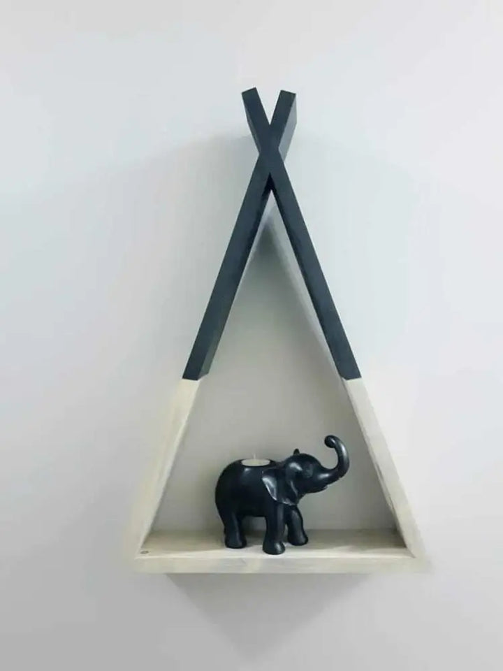 Handcrafted teepee-shaped wooden shelf with decorative elephant.