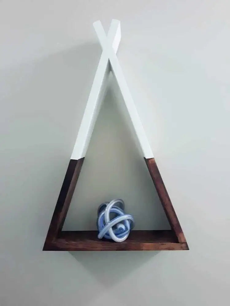 Handcrafted wooden teepee shelf with unique design for home decor.