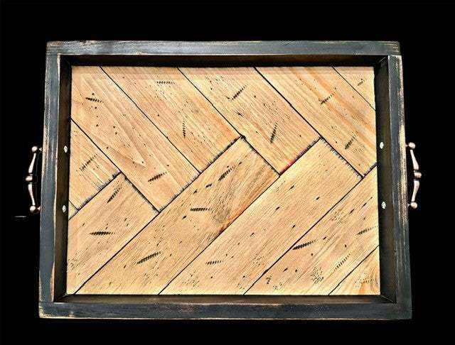 Antiqued herringbone wood tray with brushed copper handles and elevated feet.