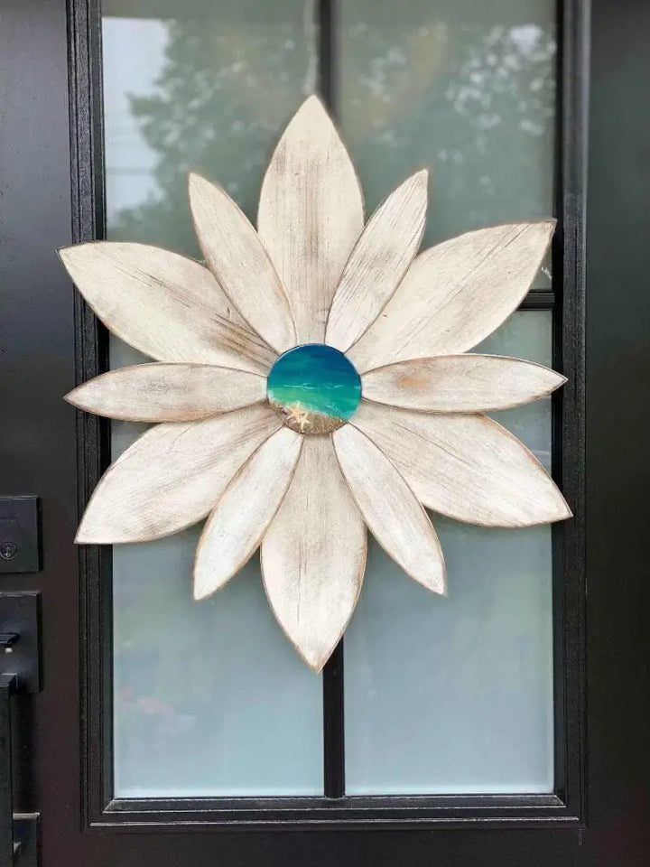 Wood flower with unique resin center for door decoration, handcrafted in Nova Scotia by Woodnwares, featuring pine wood and ocean-themed design.