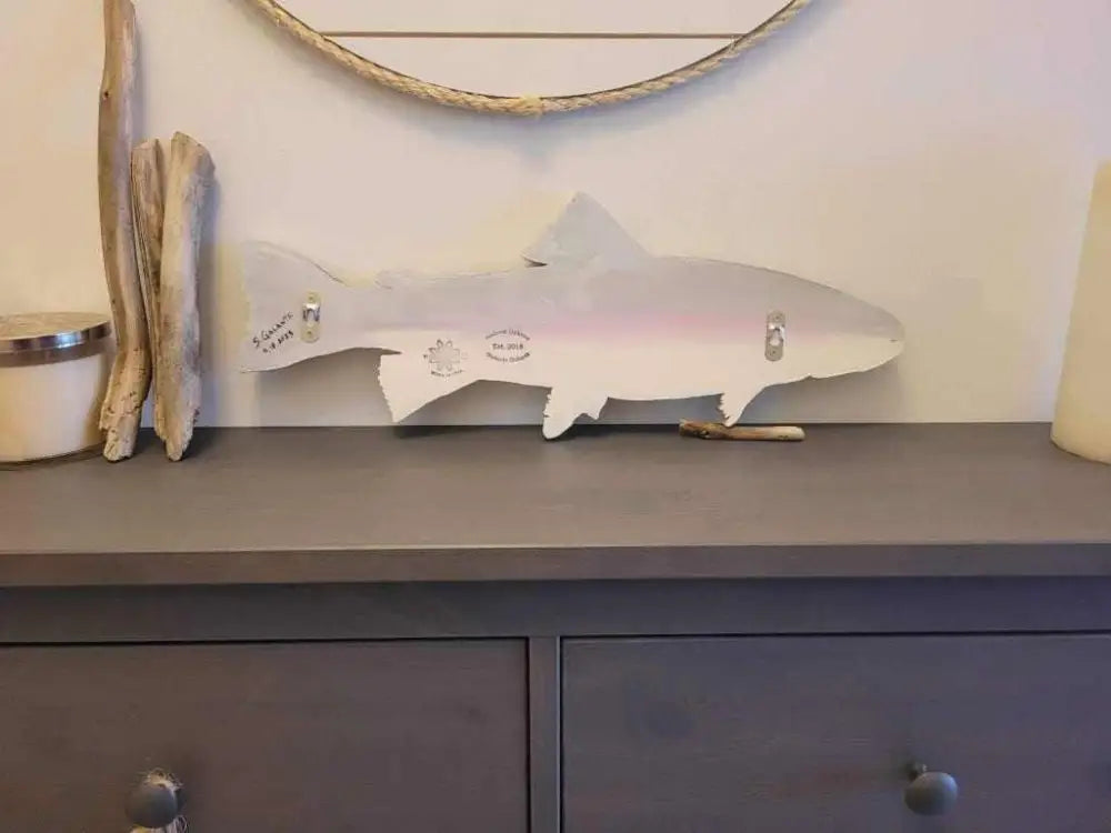 Vibrant rainbow trout wall art in pine wood with hand-painted details, 20 inches by 7 inches, for easy wall mounting.