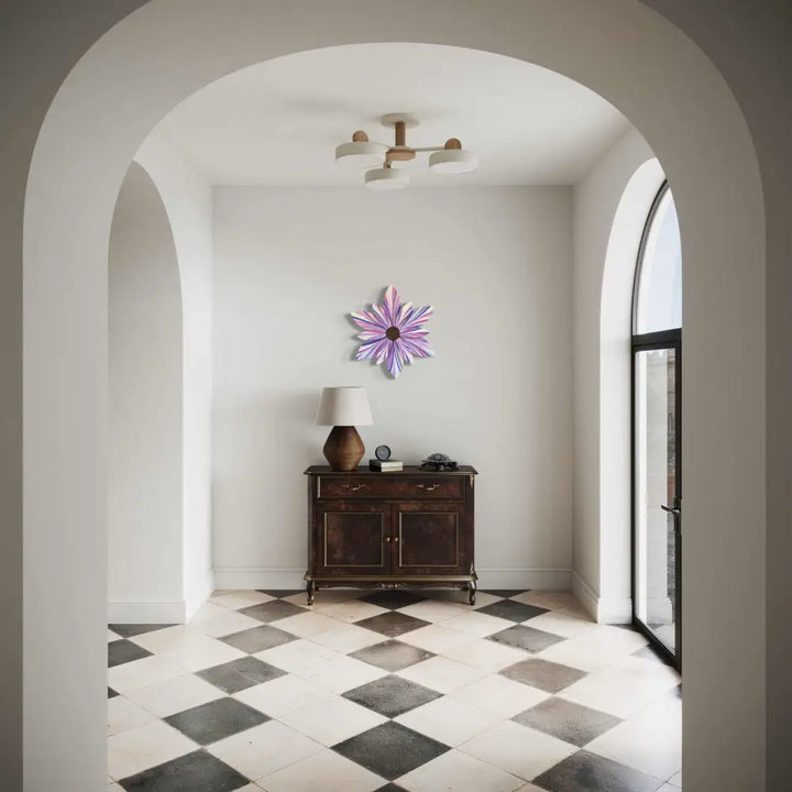 Front door wood flower decor with cotton candy design in a hallway setting.