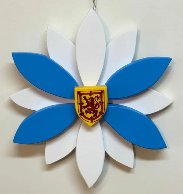 Handcrafted wooden flower door decoration with blue and white petals and Nova Scotia shield emblem in the center