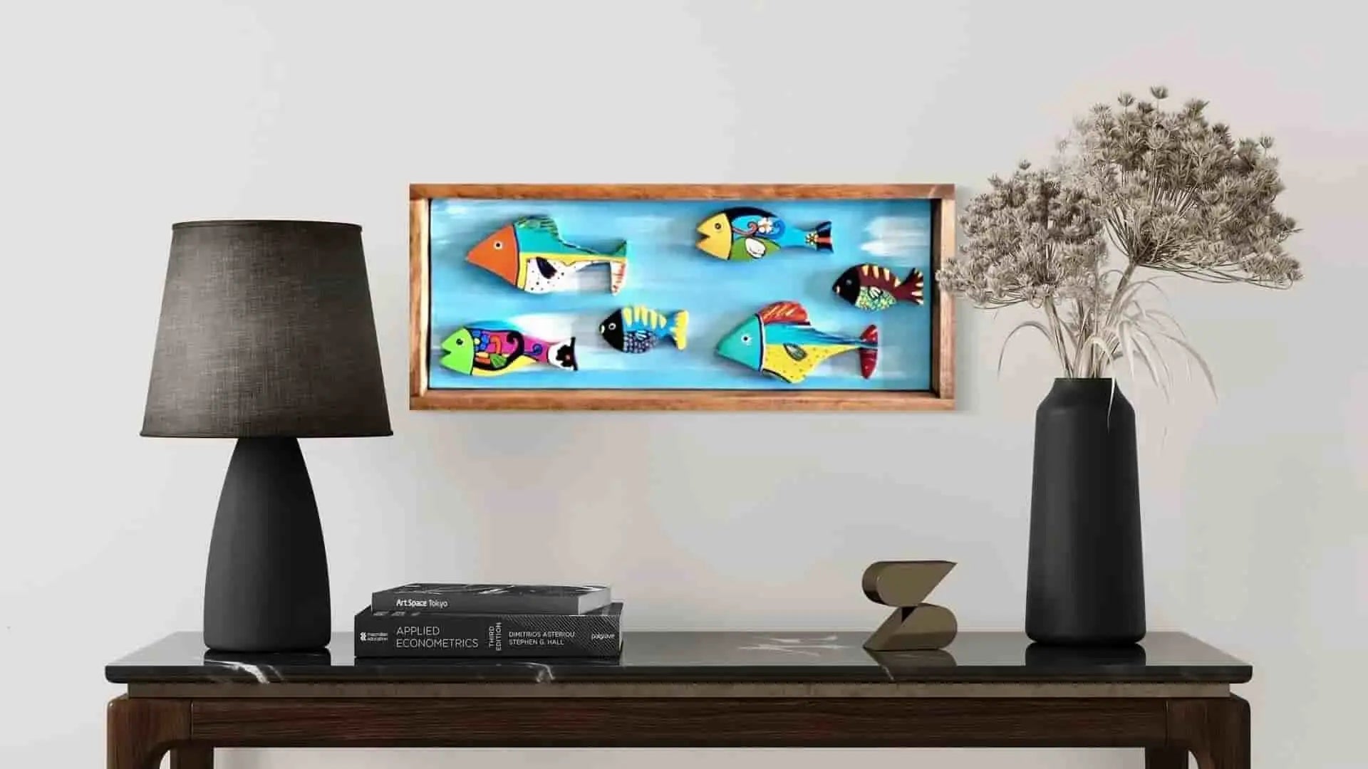 Wooden-framed fish art piece with colorful, cartoonish designs on a blue background.