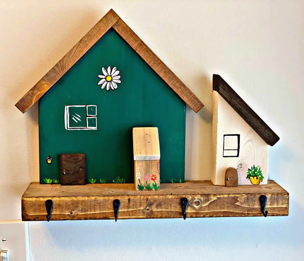 Handmade wooden key chain holder with painted village house scene, rustic wall decor.