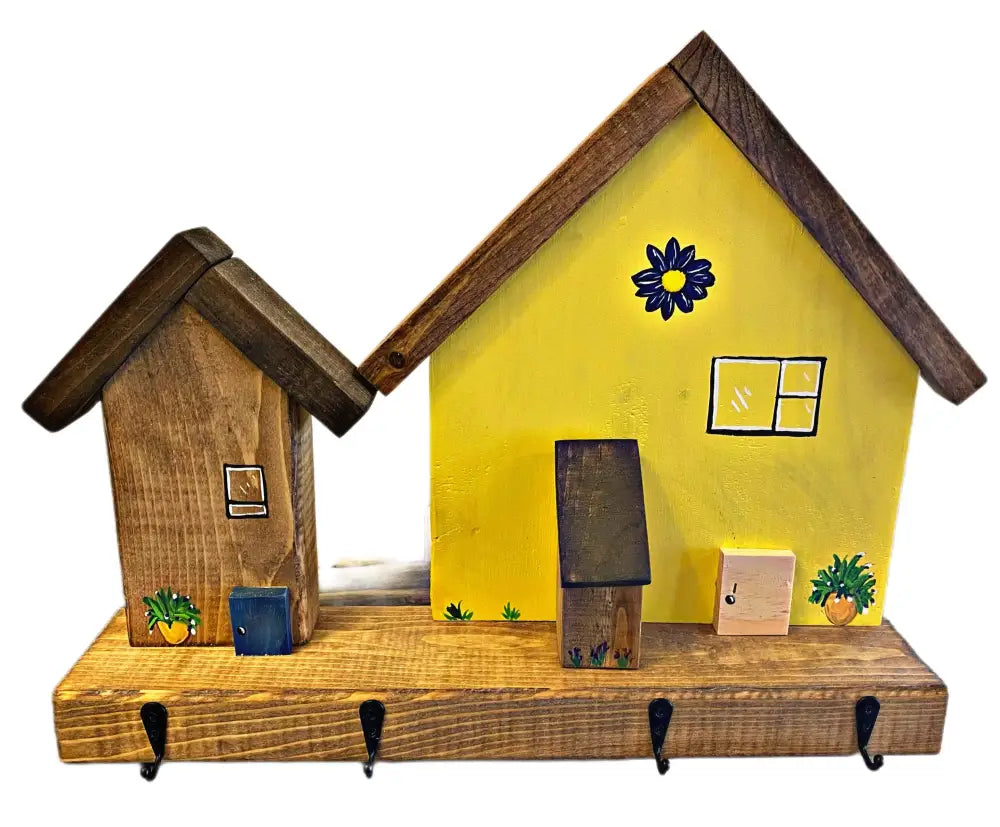 Handmade wooden key chain holder with painted village house design.