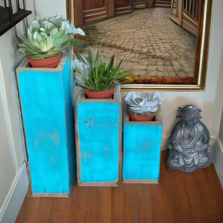 Wooden planter succulent holder set with three rustic blue planters holding various small plants, enhancing home decor.